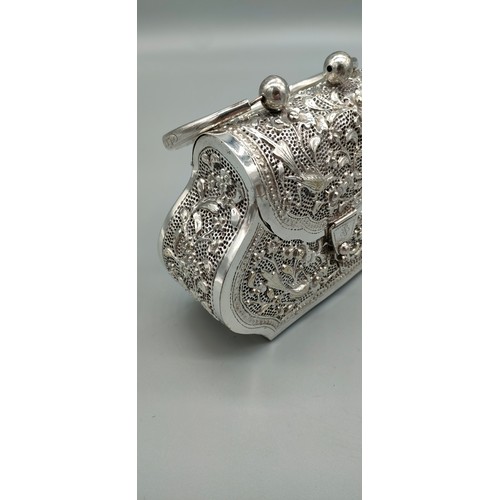 6 - Persian silver plated highly decorated and raised relief clutch bag. [Handle down- 14x18x6cm]