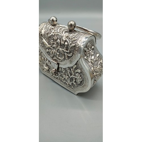 6 - Persian silver plated highly decorated and raised relief clutch bag. [Handle down- 14x18x6cm]