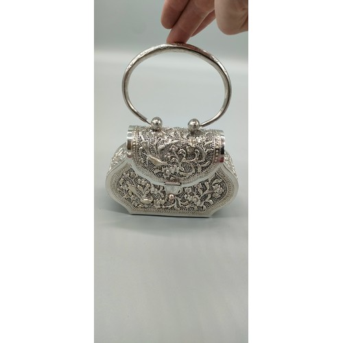 6 - Persian silver plated highly decorated and raised relief clutch bag. [Handle down- 14x18x6cm]