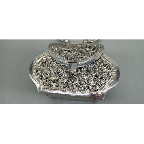 6 - Persian silver plated highly decorated and raised relief clutch bag. [Handle down- 14x18x6cm]