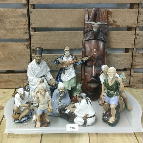 336 - A collection of Asian/ Chinese figures together with African wooden mask