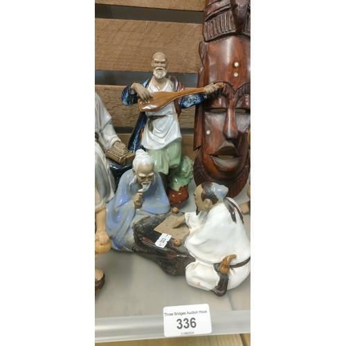 336 - A collection of Asian/ Chinese figures together with African wooden mask