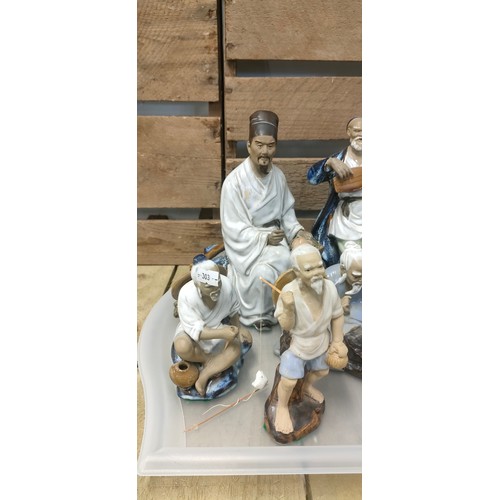 336 - A collection of Asian/ Chinese figures together with African wooden mask