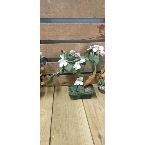 91 - Tray of Chinese hardstone and jade style stone flower design sculptures; One fitted within a cloison... 