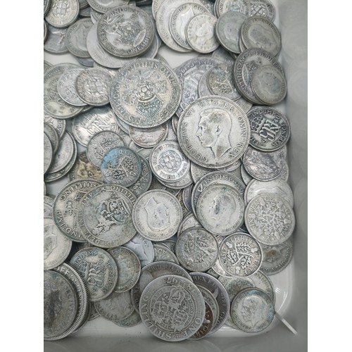 21 - A Collection of silver coinage, half crowns, three pences and six pences. [681grams]