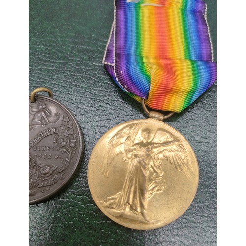 24 - Three WWI Medals and one other. Belonging to 111954 PTE. J. Duncan. R.E. and coronation medallion.