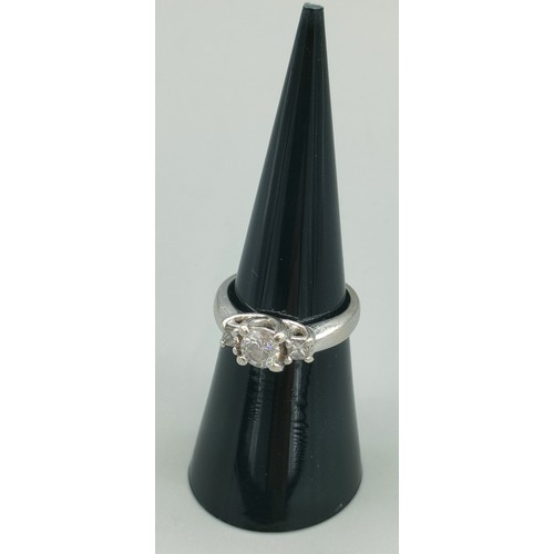 34 - A Tiffany inspired 14ct white gold and diamond set ring. Centre round cut diamond [0.50ct] off set w... 