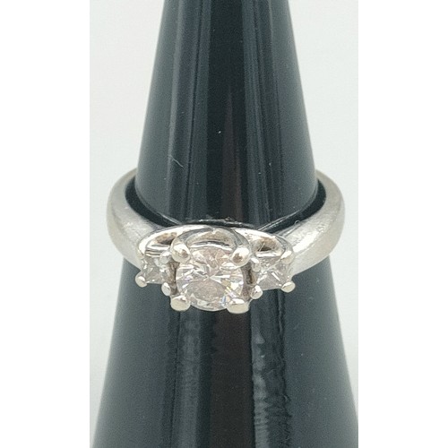 34 - A Tiffany inspired 14ct white gold and diamond set ring. Centre round cut diamond [0.50ct] off set w... 