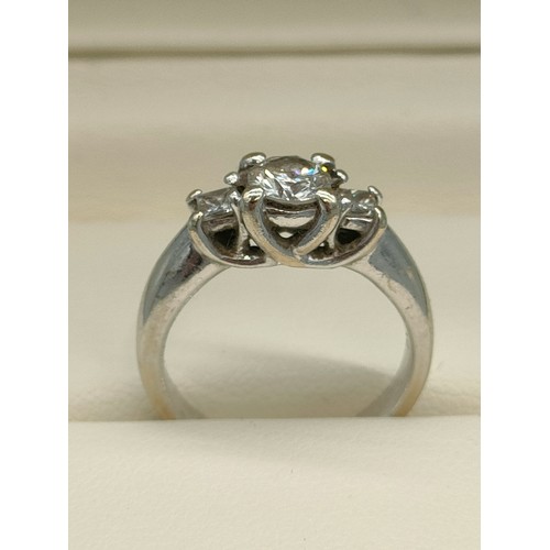 34 - A Tiffany inspired 14ct white gold and diamond set ring. Centre round cut diamond [0.50ct] off set w... 