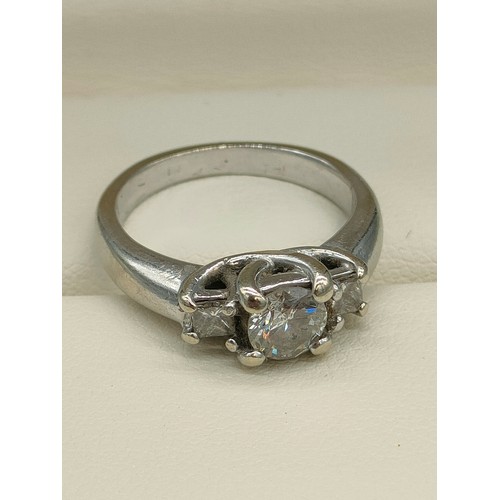 34 - A Tiffany inspired 14ct white gold and diamond set ring. Centre round cut diamond [0.50ct] off set w... 