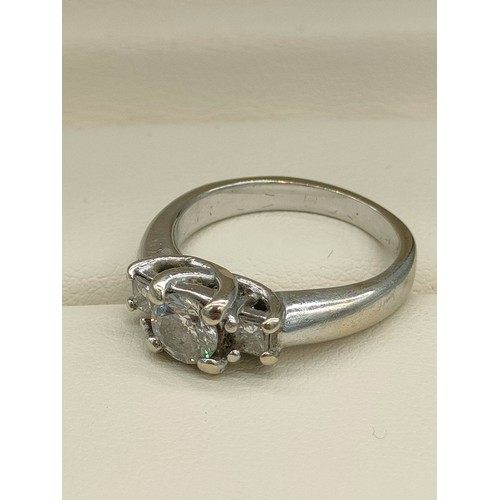 34 - A Tiffany inspired 14ct white gold and diamond set ring. Centre round cut diamond [0.50ct] off set w... 