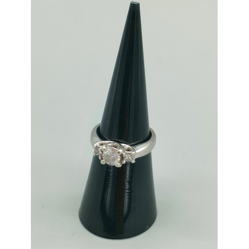 34 - A Tiffany inspired 14ct white gold and diamond set ring. Centre round cut diamond [0.50ct] off set w... 