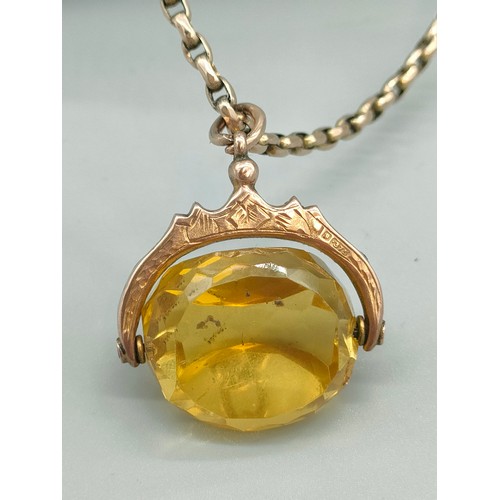 33 - Antique 9ct yellow gold and yellow glass swivel fob pendant and Victorian 9ct gold belcher chain. [H... 