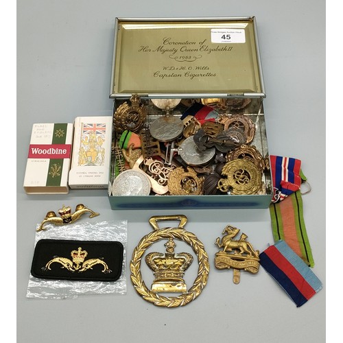 45 - Coronation Tin containing military collectables; 1935 silver George V Crown, Birmingham silver fob m... 