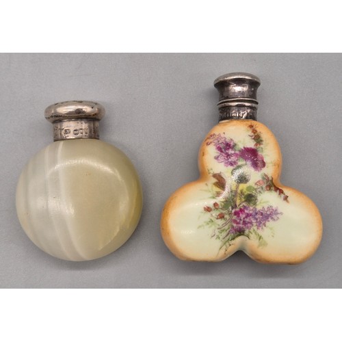 39 - Two silver topped perfume bottles; London silver top screw top and agate body, the other having a Bi... 