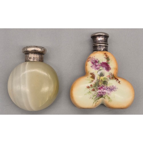 39 - Two silver topped perfume bottles; London silver top screw top and agate body, the other having a Bi... 