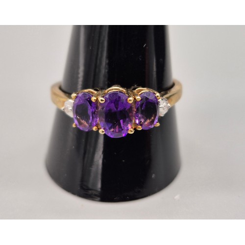 54 - 9ct yellow gold, amethyst and diamond stone ring. [Ring size T] [2.10grams]