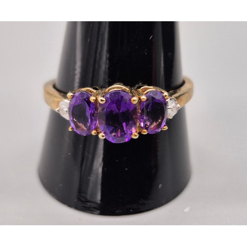 54 - 9ct yellow gold, amethyst and diamond stone ring. [Ring size T] [2.10grams]