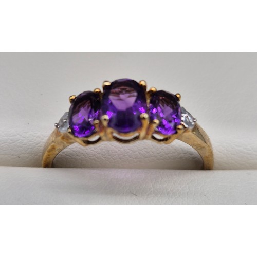 54 - 9ct yellow gold, amethyst and diamond stone ring. [Ring size T] [2.10grams]