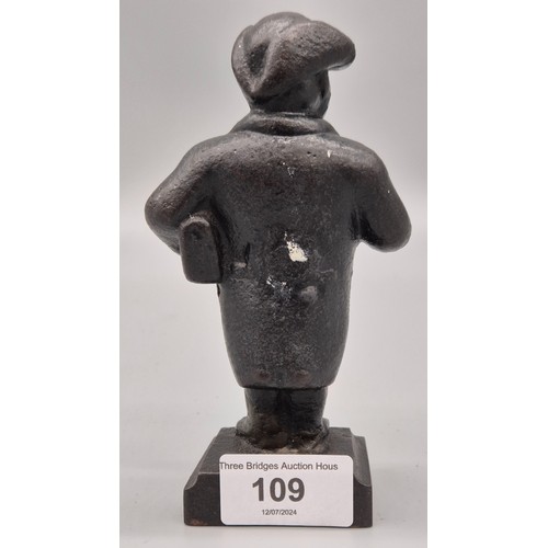 109 - 19th century Cast Iron Reverend Joshua Brooks. Old repair to ankle area. [15cm high]
