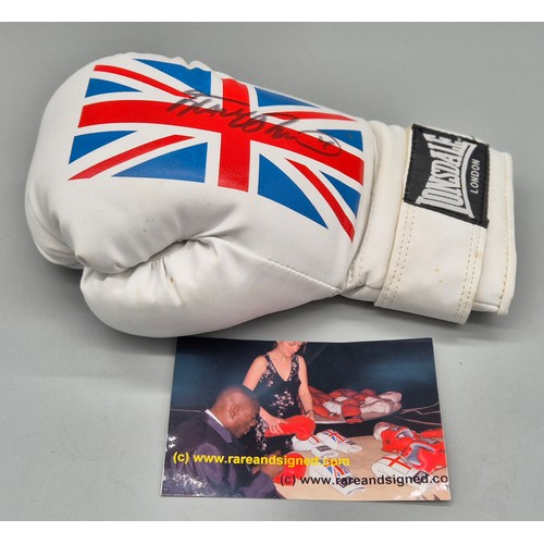 105 - Signed Frank Bruno boxing glove with photograph.