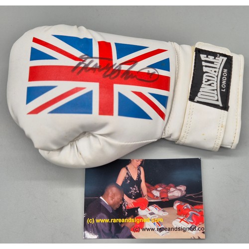 105 - Signed Frank Bruno boxing glove with photograph.