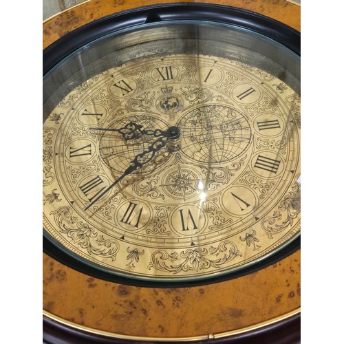 109 - The Royal Geographical Society Clock Table. Comes with leaflet. [49cm high, 41cm diameter]