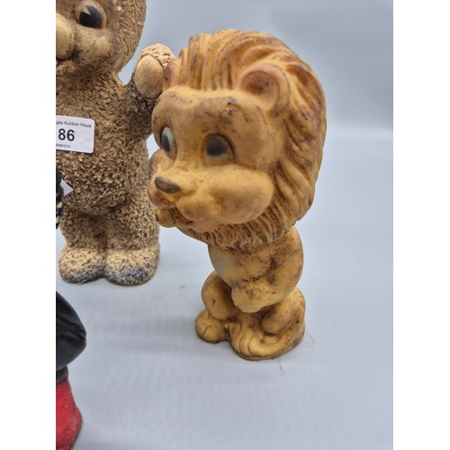 186 - A collection of four 1960s/70s squeeze toys; 1950s Combex Robertsons Golly, vintage lion squeeze toy... 