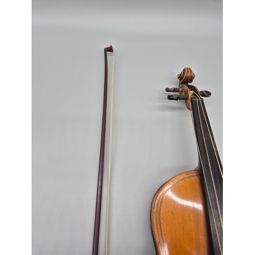 152 - Antique violin, bow and case. Label showing Manufactured in Berlin- Copy of Paulo Magini. Bow is nam... 