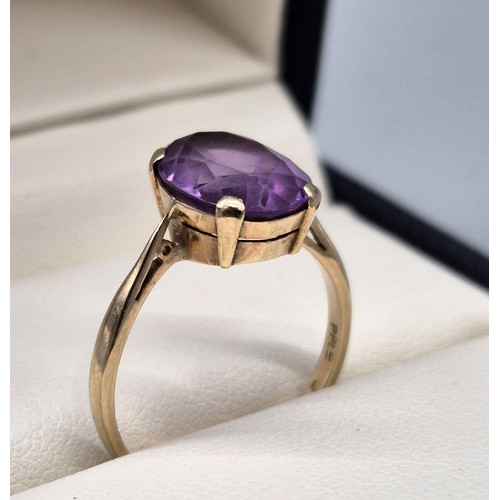 8 - 9ct yellow gold ladies ring set with a single oval cut purple sapphire. [Ring size- q] [2.71grams] [... 