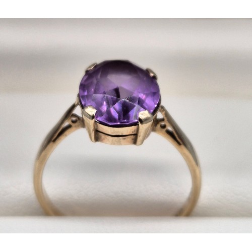 8 - 9ct yellow gold ladies ring set with a single oval cut purple sapphire. [Ring size- q] [2.71grams] [... 