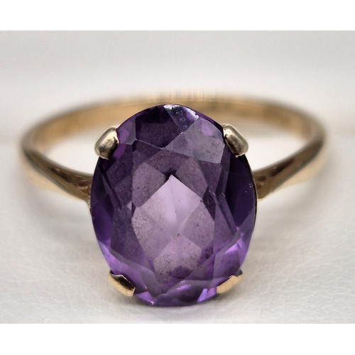 8 - 9ct yellow gold ladies ring set with a single oval cut purple sapphire. [Ring size- q] [2.71grams] [... 