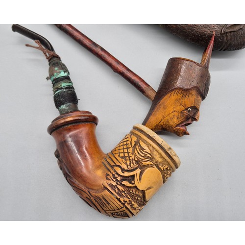 159 - A collection of six antique pipes; Black forest carved stag smoking pipe, devil style head smoking p... 