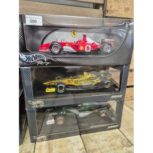 300 - Six boxed hot wheels racing 2000 formula one car models; Michael Schumacher, Ruben's Barrichello, Wi... 