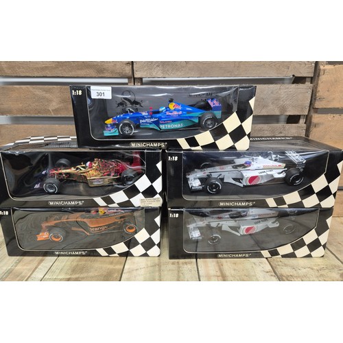 301 - A collection of five boxed mini champs 1:18 Scale formula one models; Red bull Bosworth, Tiscali, Pe... 