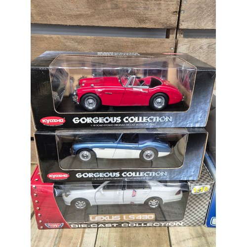 311 - A collection of five various classic car models; Kyosho 1.18 scale Austin Healey models, MGB GT MK1,... 