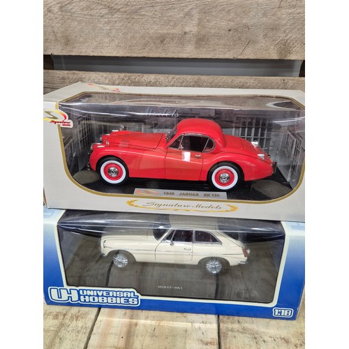 311 - A collection of five various classic car models; Kyosho 1.18 scale Austin Healey models, MGB GT MK1,... 