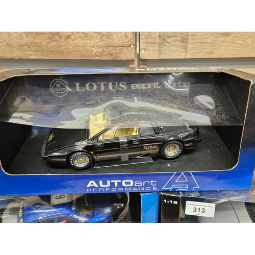 313 - A collection of five various boxed 1.18 scale models; Turbo Esprit, Subaru Impreza, Jeep model & spo... 