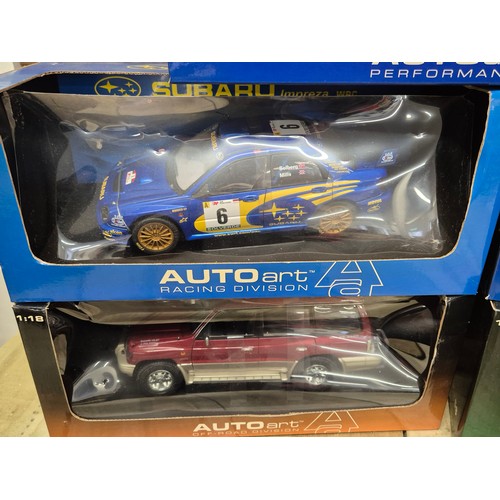 313 - A collection of five various boxed 1.18 scale models; Turbo Esprit, Subaru Impreza, Jeep model & spo... 