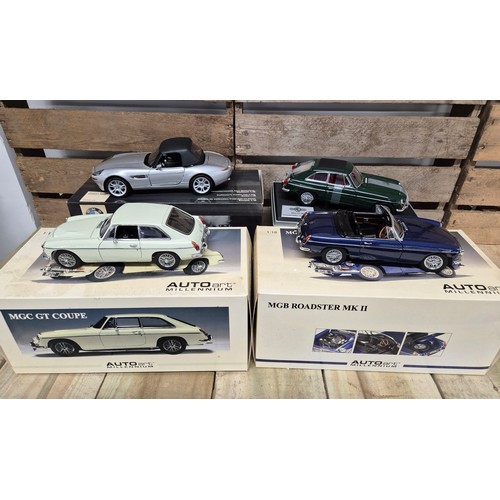 314 - A collection of four 1.18 scale classic car models MGB Roadster MK11, MGC GT1969 model & James Bond ... 