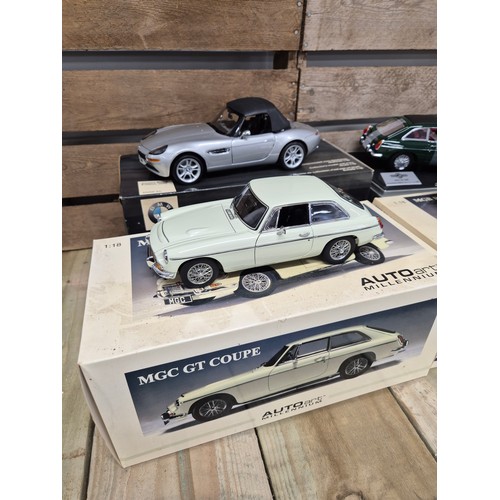 314 - A collection of four 1.18 scale classic car models MGB Roadster MK11, MGC GT1969 model & James Bond ... 