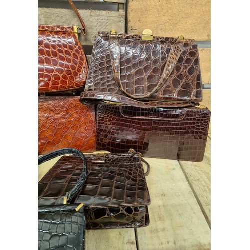 196 - A collection of eight crocodile skin vintage clutch hand bags; British & German made