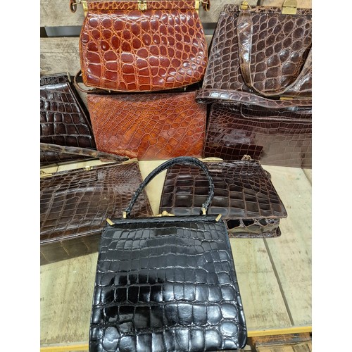 196 - A collection of eight crocodile skin vintage clutch hand bags; British & German made