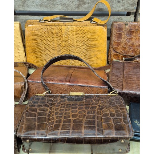 200 - A collection of nine vintage Crocodile and lizard skin clutch handbags; Mappin & Webb, Riviera bags ... 