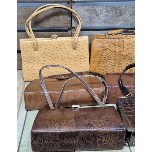 200 - A collection of nine vintage Crocodile and lizard skin clutch handbags; Mappin & Webb, Riviera bags ... 