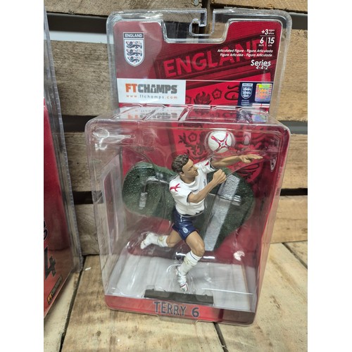 317 - A Collection of five England boxed football players action figures & two framed english league footb... 