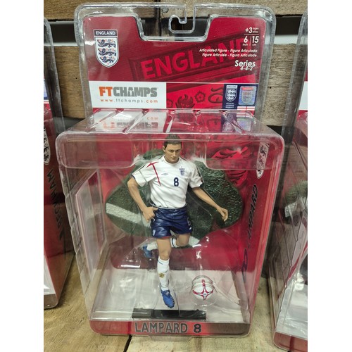 317 - A Collection of five England boxed football players action figures & two framed english league footb... 