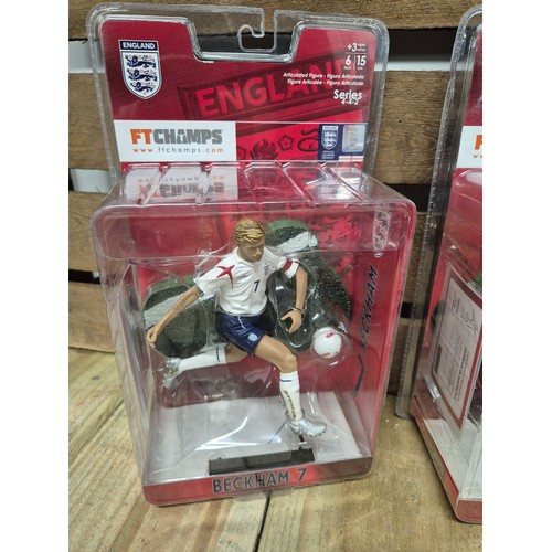 317 - A Collection of five England boxed football players action figures & two framed english league footb... 