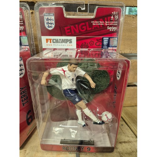 317 - A Collection of five England boxed football players action figures & two framed english league footb... 