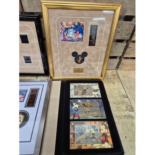 323 - A collection of three Walt Disney film cells together with Disney showcase plaques; Mickey Mouse, Th... 